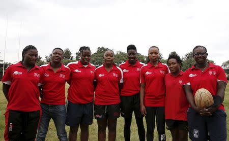 Members of the Kenya Women's Rugby team (L-R) Janet Okello, Irene Atieno, Shilla Chajira, Doreen Remour, Cynthia Camilla, Linet moraa, Mary Musieka and Philadelphia Orlando pose for a photograph after a light training session at the RFUEA grounds in the capital Nairobi, April 4, 2016. REUTERS/Thomas Mukoya