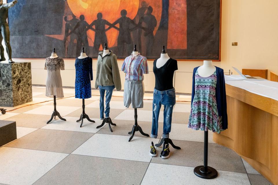 outfits worn by survivors of sexual violence on display at the 