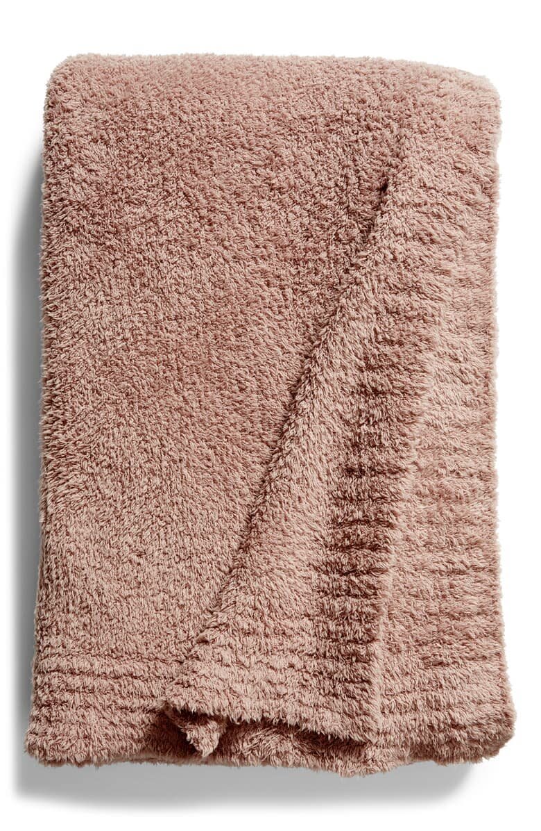 It doesn&rsquo;t matter if they already have a favorite blanket at home. No one can resist the luxurious softness of <a href="https://fave.co/35BqyOO" target="_blank" rel="noopener noreferrer">a Barefoot Dreams blanket</a>. In fact, my husband and I have had to make TV watching time a no-throw zone, because whoever is snuggled up immediately falls asleep. <a href="https://fave.co/35BqyOO" target="_blank" rel="noopener noreferrer">Get it at Nordstrom</a>.