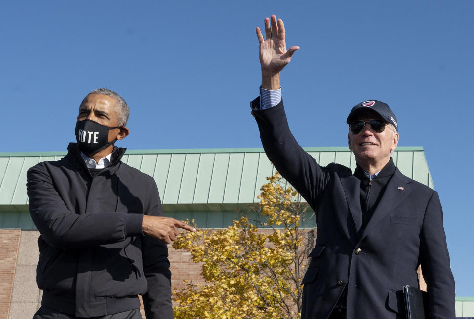 Former US President Barack Obama (L) joins Democratic presidential candidate Joe Biden at a campaign event in Flint, Michigan, on October 31, 2020. (Photo by Jim WATSON / AFP) (Photo by JIM WATSON/AFP via Getty Images)