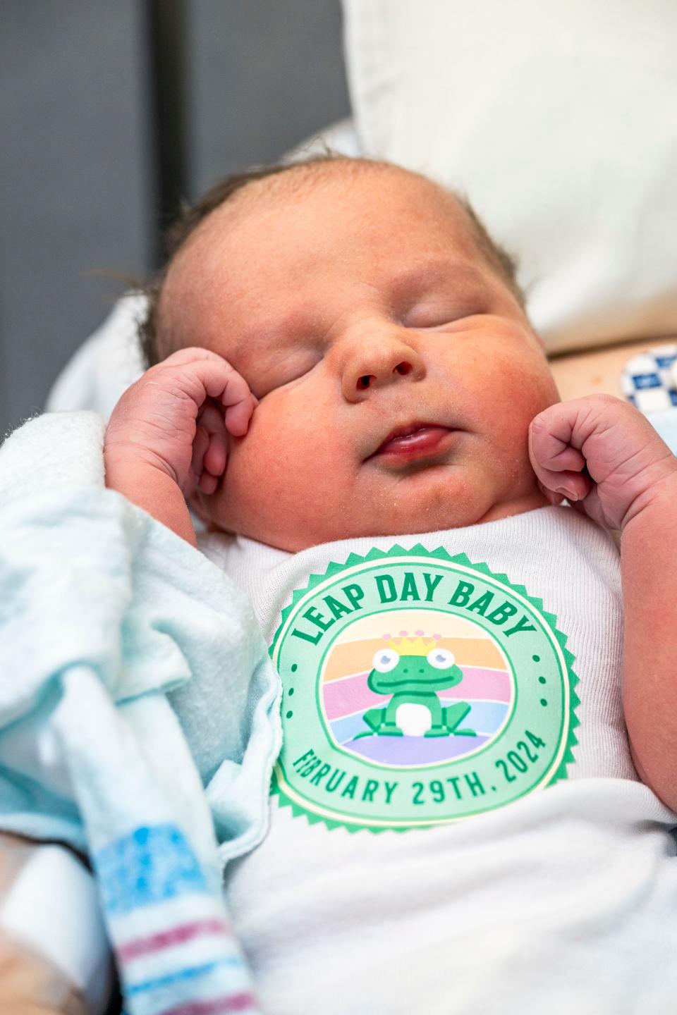 A baby boy born at Cleveland Clinic Akron General on leap day sports one of the special onesies made for the occasion by one of the hospital's staff.