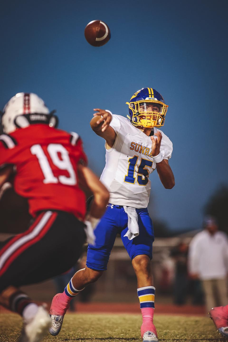 Sunray's Armando Lujan (15) throws a pass against Gruver's Gus Gaillard (19) during a District 3-2A Division II game Friday, Oct. 29, 2021 at Greyhound Stadium in Gruver, Texas.