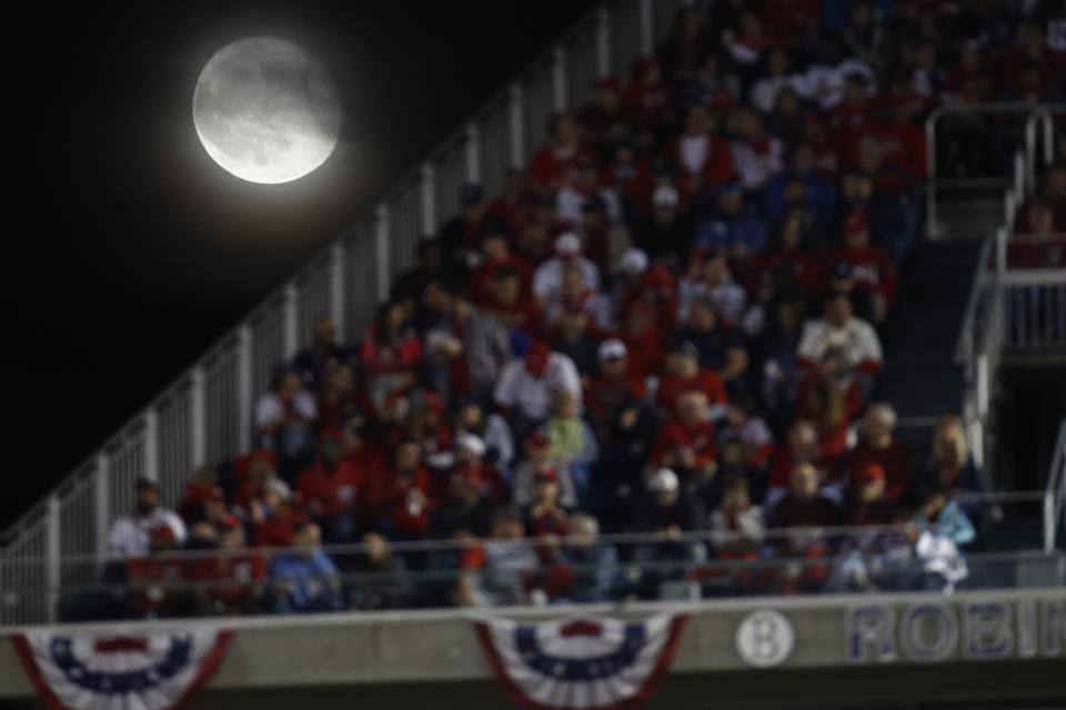 The moon is seen over Nationals Park during the third inning of Game 4 of the baseball National League Championship Series between the St. Louis Cardinals and the Washington Nationals Tuesday, Oct. 15, 2019, in Washington. (AP Photo/Patrick Semansky)