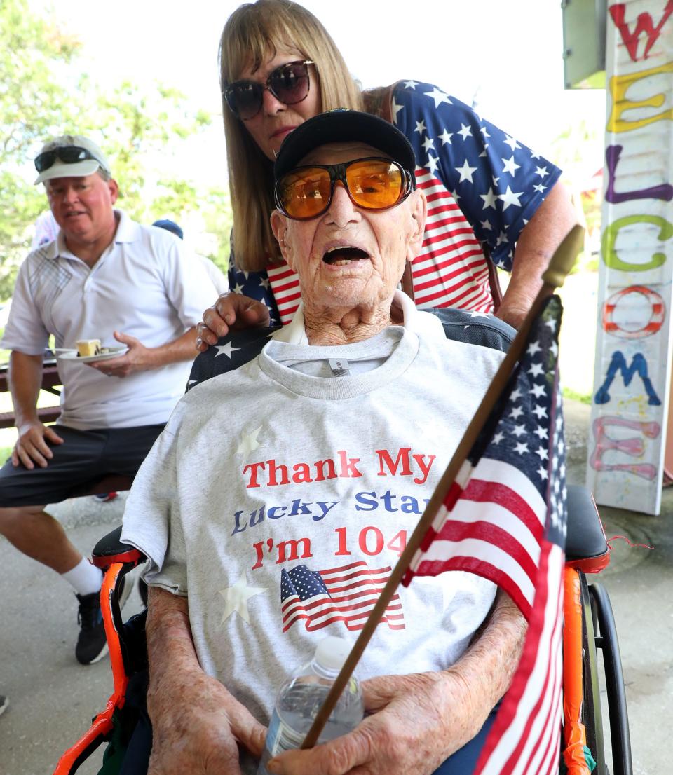 World War II veteran Ed Vrona visits with his birthday party guests at his 104th birthday party on July 4th at Emory L. Bennett Memorial Veterans Nursing Home in Daytona Beach. Vrona died on Friday, July 14, after battling prostate cancer.