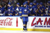 Buffalo Sabres right wing Alex Tuch (89) is congratulated for a goal against the Washington Capitals during the second period of an NHL hockey game Thursday, April 11, 2024, in Buffalo, N.Y. (AP Photo/Jeffrey T. Barnes)