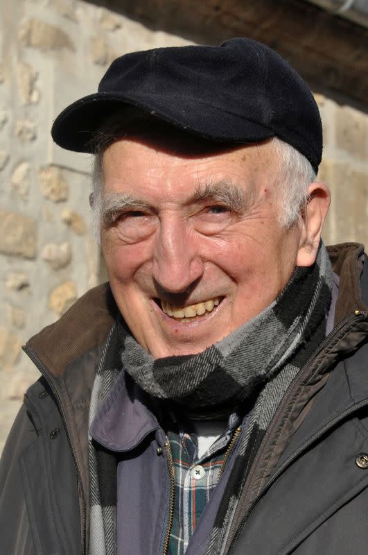 FILE PHOTO: Jean Vanier, who won the 2015 Templeton Prize, poses outside his home in Trosly-Breuil