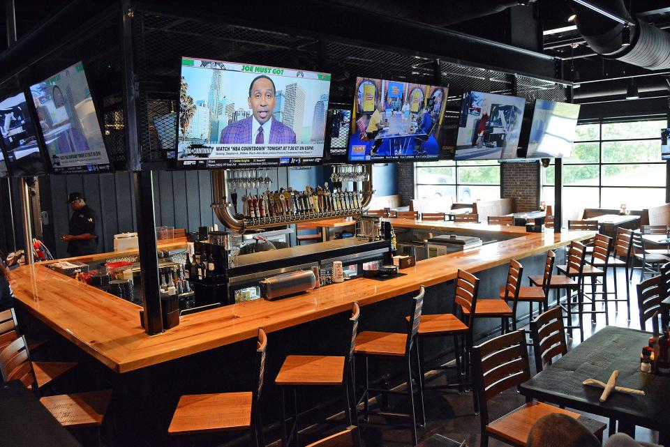 A view of the bar area Monday at Walk-Ons Sports Bistreaux at 2541 Broadway Bluff Drive, the former home of Houlihan's. The restaurant celebrated its grand opening Monday. 