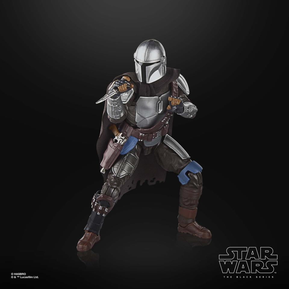 The Mandalorian action figure posed against a black background