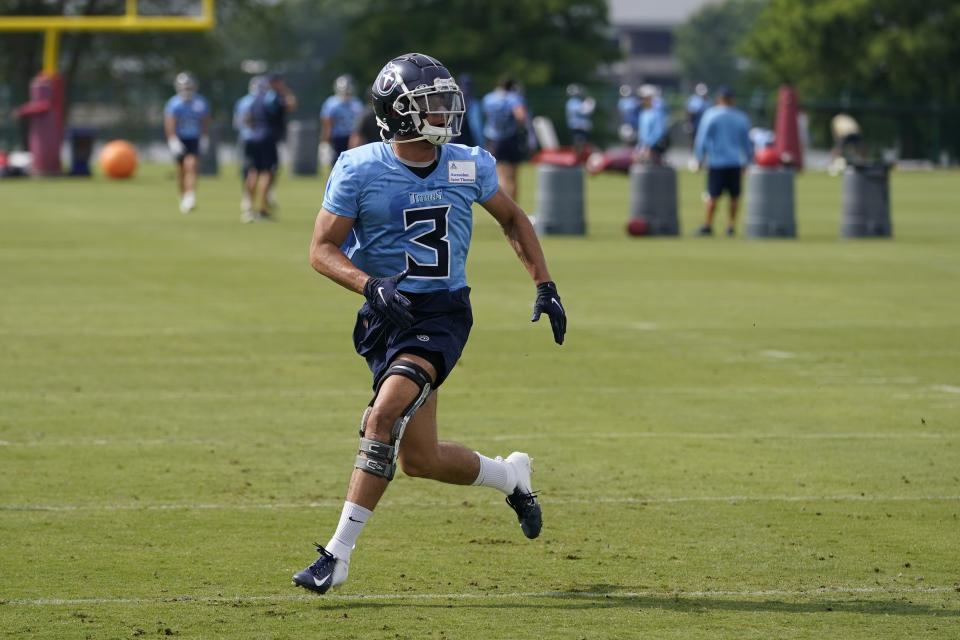 Tennessee Titans cornerback Caleb Farley takes part in a drill at the NFL football team's practice facility on June 7, 2022, in Nashville, Tenn. Both Farley and wide receiver Robert Woods have made impressive recoveries from the torn ACLs that ended the 2021 season for each. (AP Photo/Mark Humphrey)