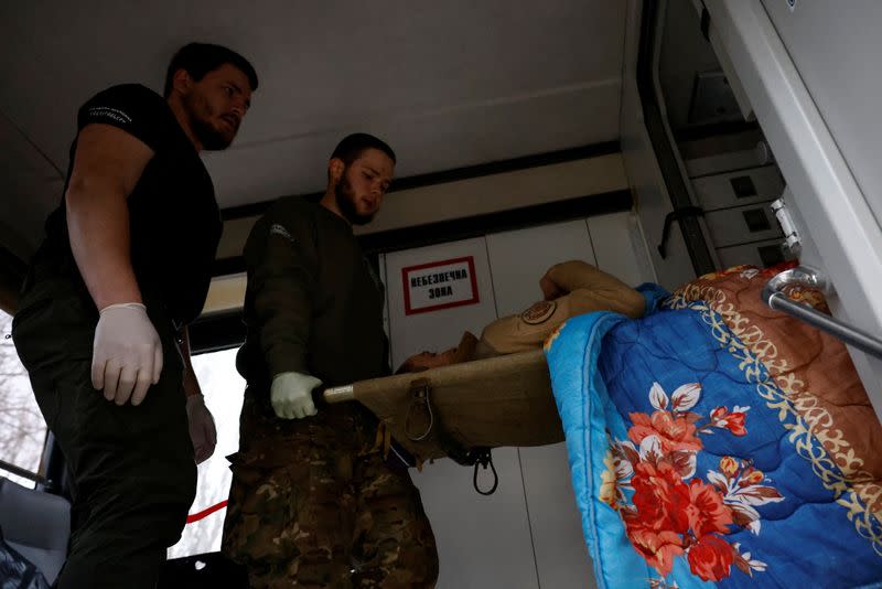 Ukrainian volunteer medics use a converted bus to transport wounded Ukrainian soldiers from the eastern frontline near Bakhmut to a hospital in Dnipro