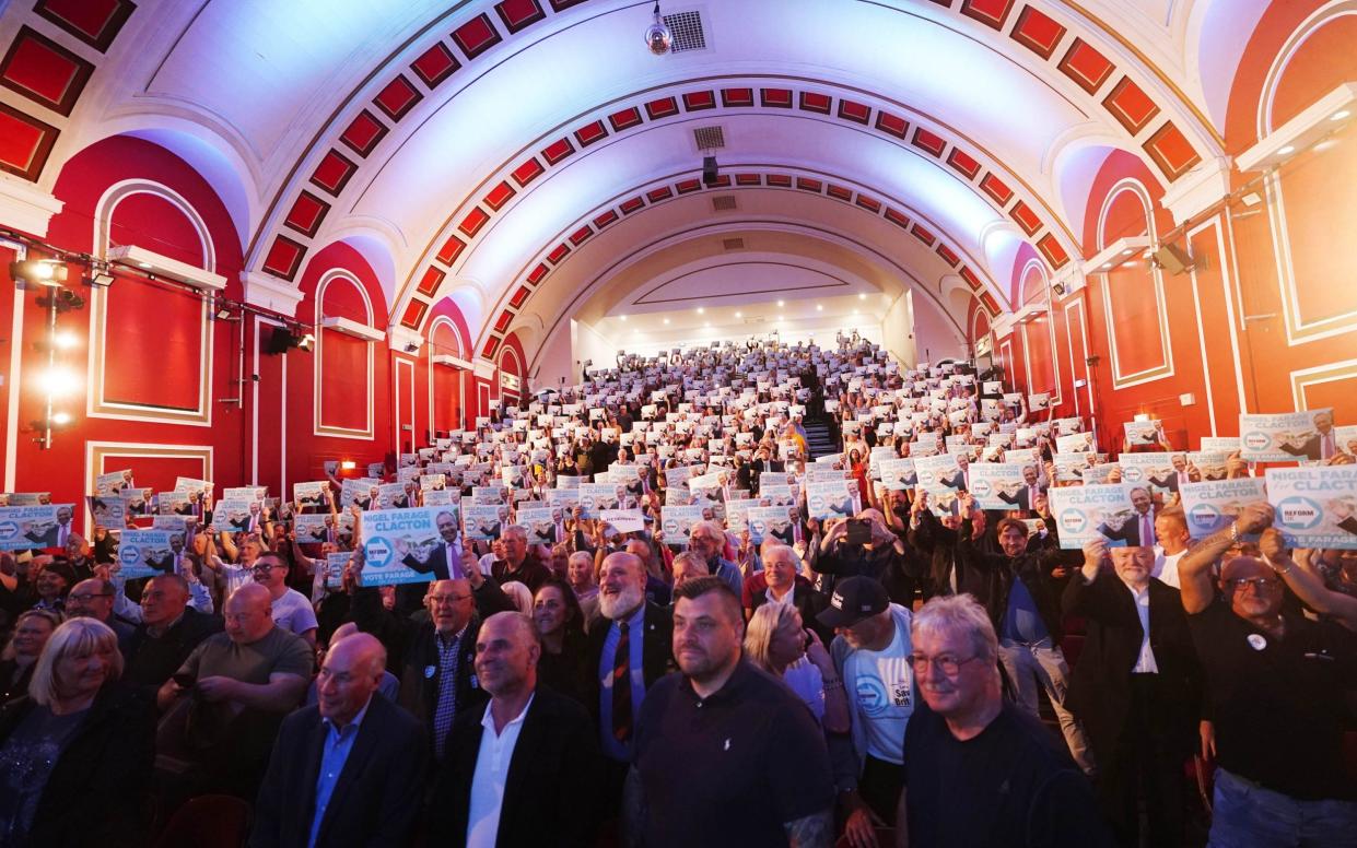 The audience listen to Reform UK leader Nigel Farage speaking at Princes Theatre in Clacton