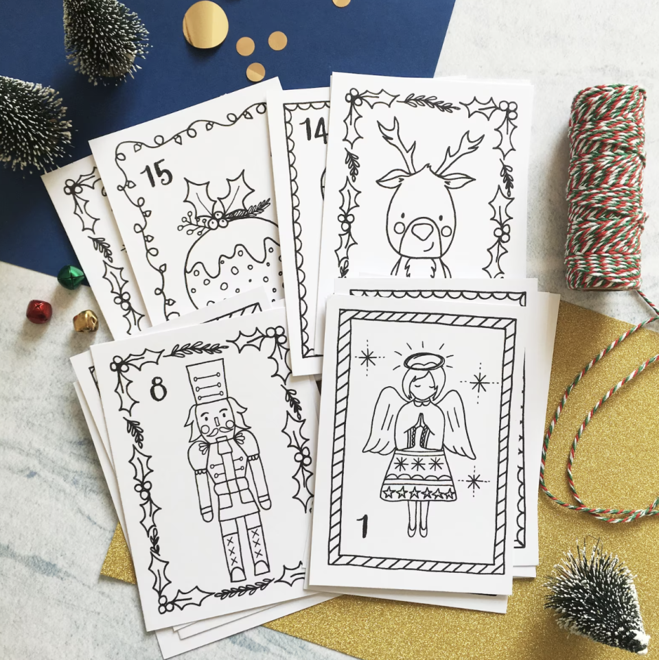 Colouring Advent Calendar colouring books with reindeer, angel and tin man cards (Photo via Etsy)