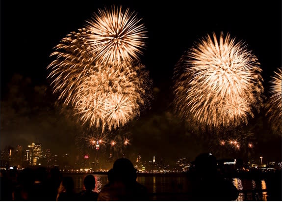 Fireworks explode over New York City of the Fourth of July.