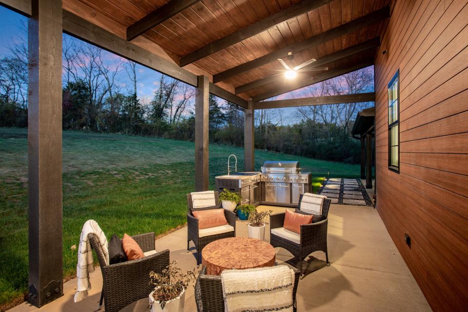 The back patio space at 259 Flynn Road in Gallatin features a full outdoor kitchen ideal for entertaining.