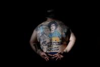 The Wider Image: Argentines celebrate 'eternal love' for Maradona with tattoos