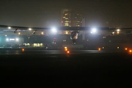 Solar Impulse 2, a solar powered plane, lands at an airport in Abu Dhabi, United Arab Emirates July 26, 2016. REUTERS/Stringer