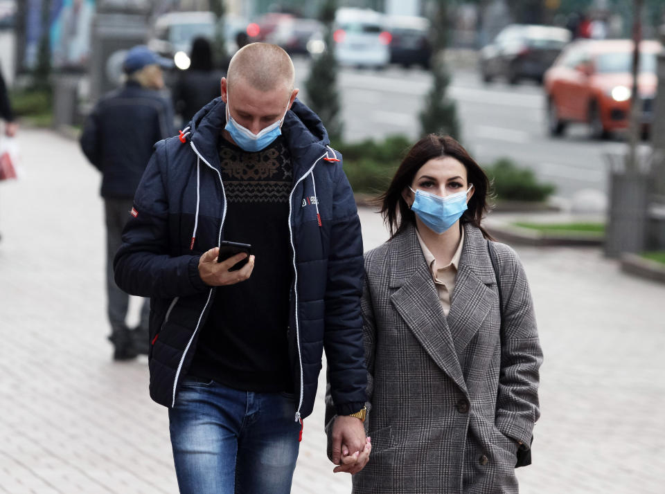 People pictured in masks.