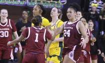 Oklahoma guard Skylar Vann (24) slaps hands with guard Nevaeh Tot with seconds remaining against Baylor in overtime during an NCAA college basketball game Tuesday, Feb. 7, 2023, in Waco, Texas. (Rod Aydelotte/Waco Tribune-Herald via AP)