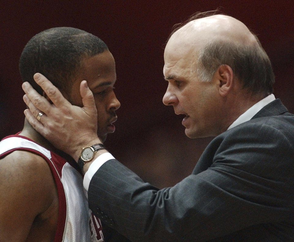 FILE - Saint Joseph's coach Phil Martelli, right, talks with guard Dwayne Lee during the second half of an NCAA college basketball game at the Atlantic 10 Conference tournament in Dayton, Ohio, Friday, March 14, 2003. Dayton won 76-73. (AP Photo/Al Behrman, File)