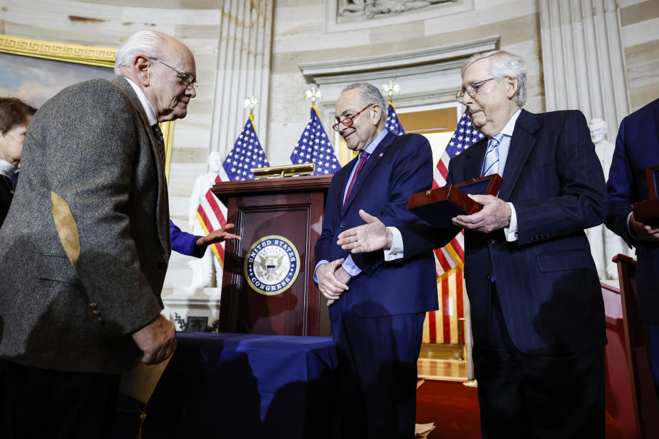 At a Capitol ceremony to honor the police response on Jan. 6, 2021, Sen. Minority Leader Mitch McConnell holds out his hand for handshake with Charles Sicknick, father of Capitol Police officer Brian Sicknick, who died after the events of Jan. 6. / Credit: / Getty Images