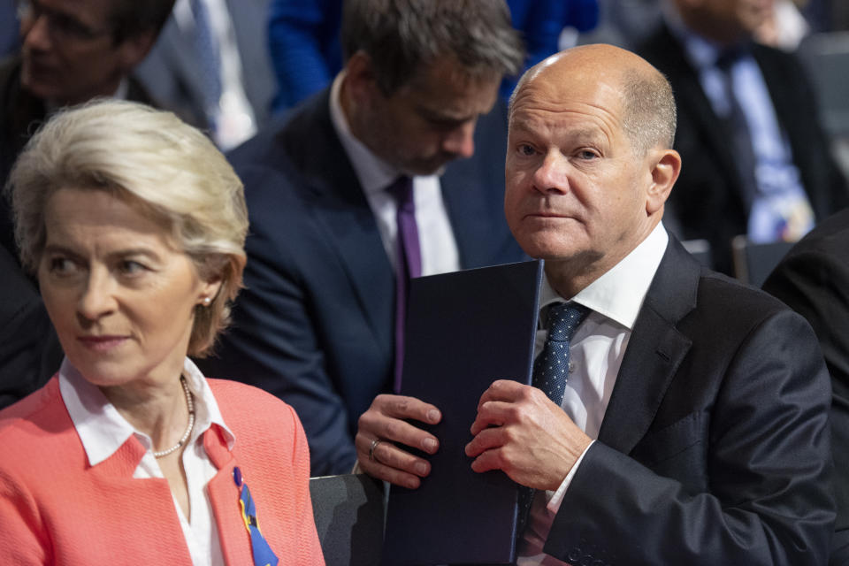 European Commission President Ursula von der Leyen, left, and German Chancellor Olaf Scholz attend the International Expert Conference on the Reconstruction of Ukraine, in Berlin, Tuesday, Oct. 25, 2022. German and European Union leaders gathered experts on Tuesday to start work on what they describe as a “new Marshall plan” for the rebuilding of Ukraine. (Christophe Gateau/dpa via AP)