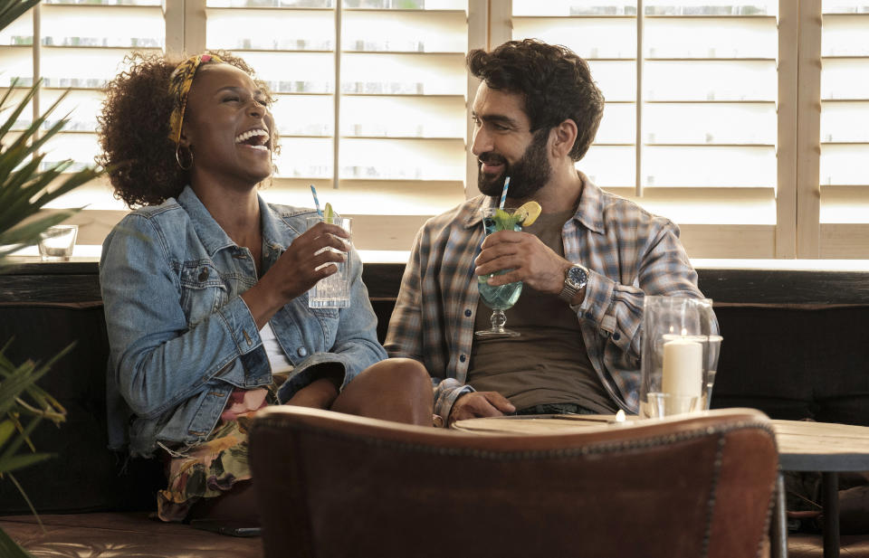 This image released by Netflix shows Issa Rae as Leilani, left, and Kumail Nanjiana as Jibran in a scene from "The Lovebirds." (Skip Bolen/Netflix via AP)