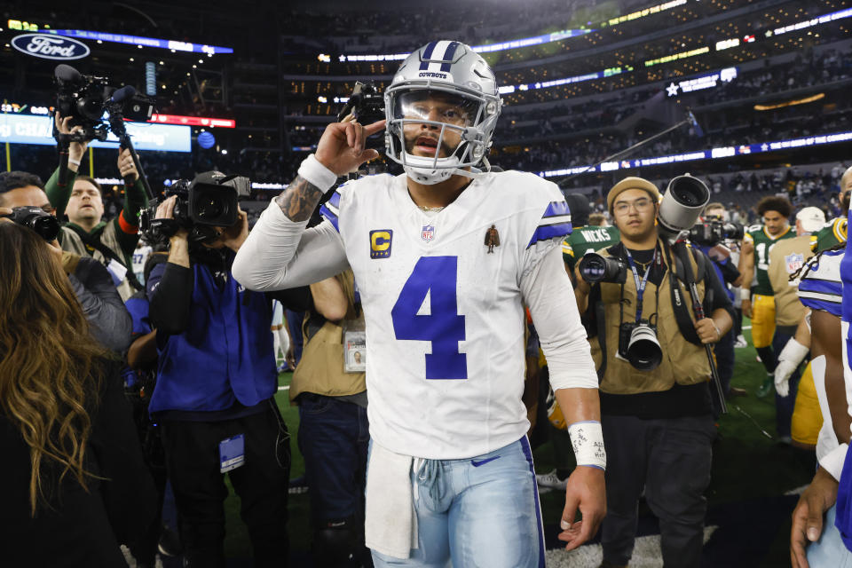 Dallas Cowboys quarterback Dak Prescott walks on the field following an NFL football game against the Green Bay Packers, Sunday, Jan. 14, 2024, in Arlington, Texas. The Packers won 48-32. (AP Photo/Michael Ainsworth)