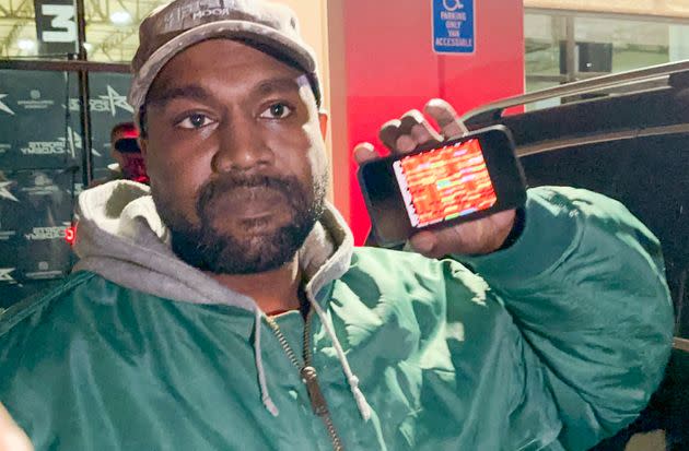Ye, the artist formerly known as Kanye West, showed a spreadsheet on his phone to blame Jews for his business losses. (Photo: MEGA via Getty Images)