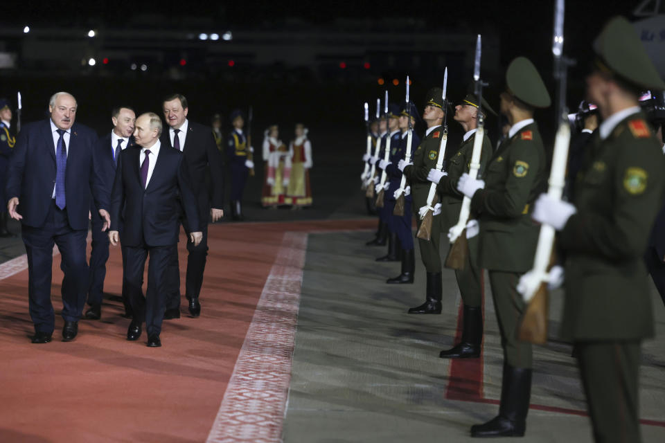 Russian President Vladimir Putin, right, listens to Belarusian President Alexander Lukashenko, as they review an honor guard upon his arrival at an international airport in Minsk, Belarus, Thursday, May 23, 2024. Putin on Thursday evening arrived in Belarus for a two-day visit. (Mikhail Metzel, Sputnik, Kremlin Pool Photo via AP)