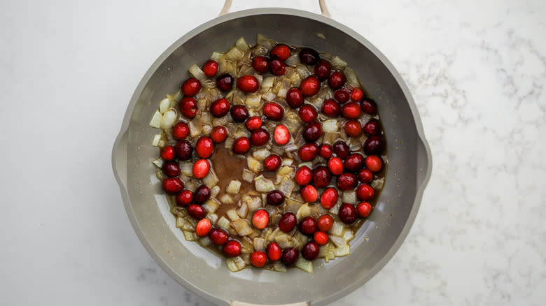 cranberries onion and brown sugar in saute pan