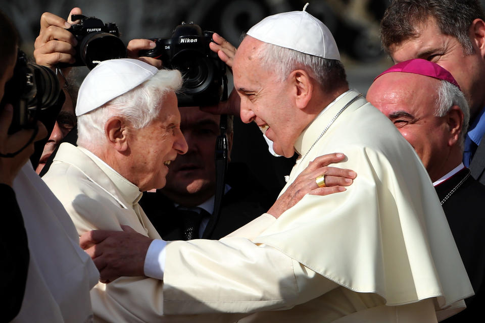 Pope Francis, right, greets Pope Emeritus Benedict XVI at St. Peter's Basilica at the Vatican on September 28, 2014. / Credit: Franco Origlia/Getty