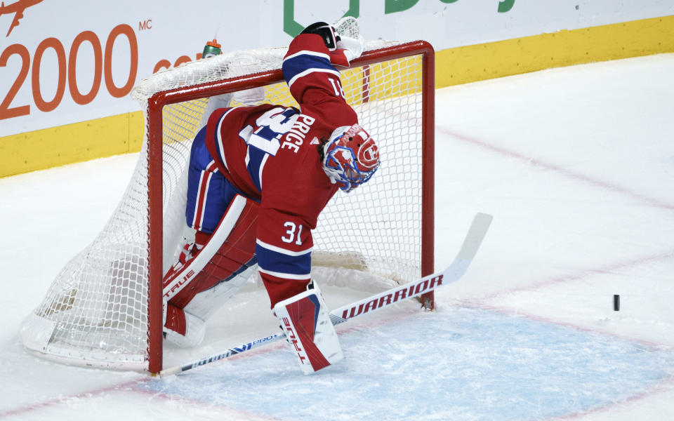 Montreal Canadiens goaltender Carey Price deflects a shot during the second period of an NHL hockey game against the Edmonton Oilers, Tuesday, March 30, 2021 in Montreal. (Paul Chiasson/The Canadian Press via AP)