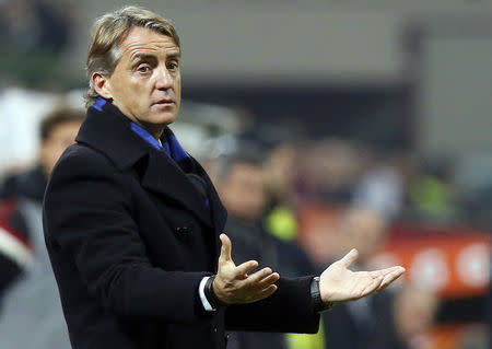 Inter Milan's coach Roberto Mancini gestures during their Italian Serie A soccer match against AC Milan at the San Siro stadium in Milan November 23, 2014. REUTERS/Alessandro Garofalo