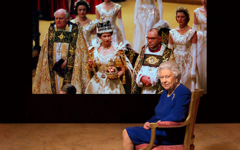 The Queen watching footage from The Coronation - Credit: Photographer: Julian Calder