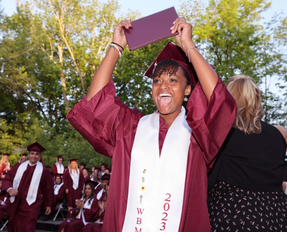 Lasadia Gurley celebrates as she receives her diploma during the West Bridgewater Middle-Senior High School graduation at War Memorial Park on Friday, May 26, 2023. 