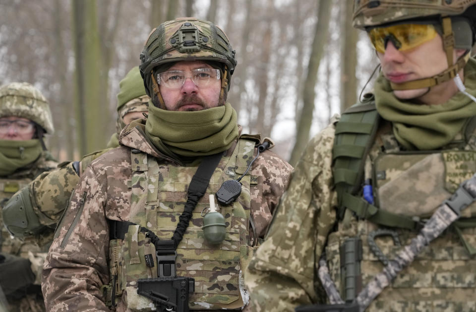 Members of Ukraine's Territorial Defense Forces, volunteer military units of the Armed Forces, train in a city park in Kyiv, Ukraine, Saturday, Jan. 22, 2022. Dozens of civilians have been joining Ukraine's army reserves in recent weeks amid fears about Russian invasion. (AP Photo/Efrem Lukatsky)