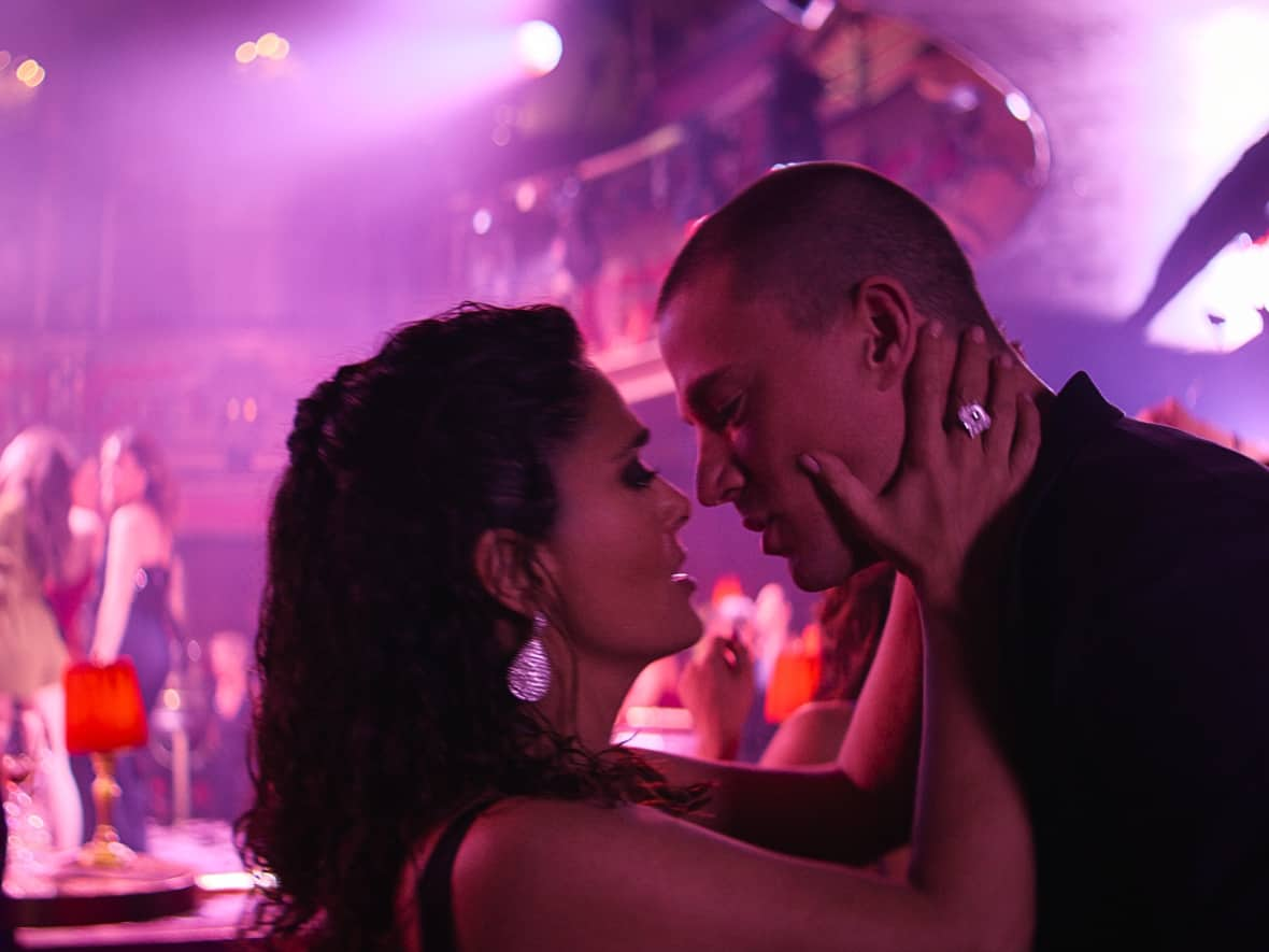 Max and Mike (Salma Hayek and Channing Tatum) share a moment in a scene from Magic Mike's Last Dance.  (Warner Bros. Entertainment - image credit)