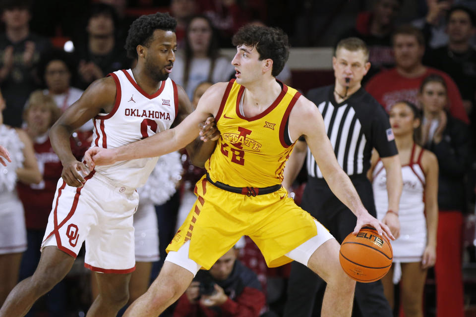 Iowa State forward Milan Momcilovic, right, dribbles the ball as Oklahoma guard Le'Tre Darthard, left, defends during the second half of an NCAA college basketball game Saturday, Jan. 6, 2024, in Norman, Okla. (AP Photo/Nate Billings)