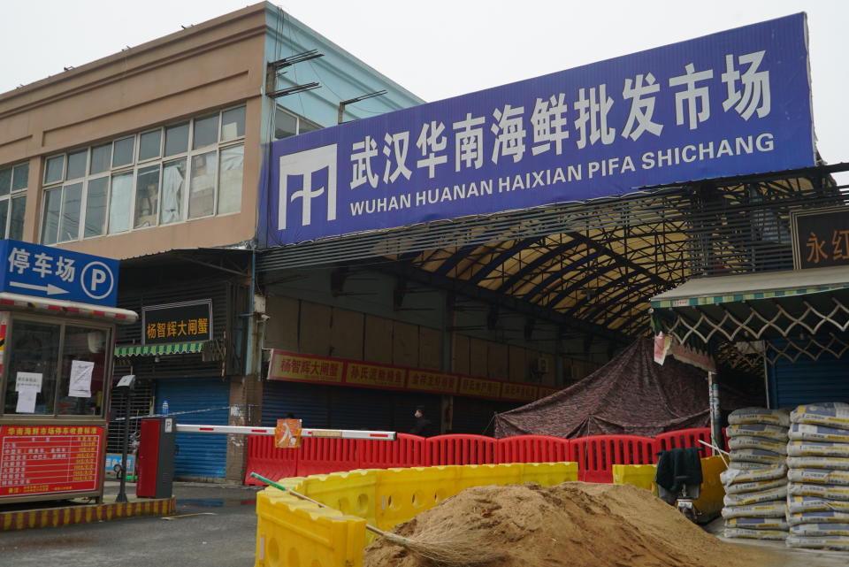 FILE - The Huanan Seafood Wholesale Market, sits closed in Wuhan in central China's Hubei province on Jan. 21, 2020. International scientists have examined previously unavailable genetic data from samples collected at a market in China close to where the first human cases of COVID-19 were detected and said they have found suggestions the pandemic originated from animals, not a lab. (AP Photo/Dake Kang, File)