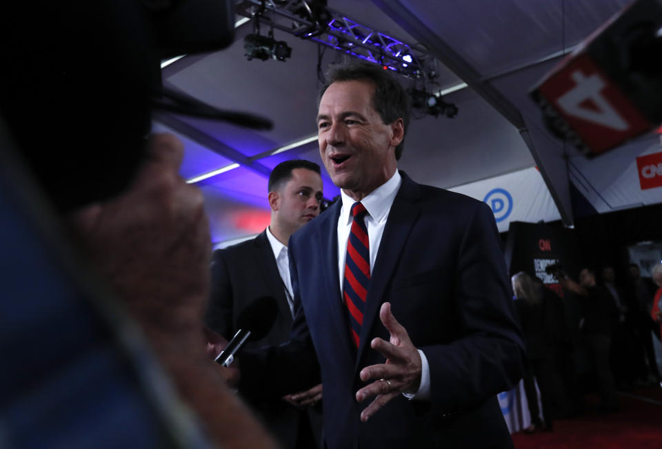 Montana Governor Steve Bullock talks to reporters after the first of two Democratic presidential primary debates hosted by CNN Tuesday, July 30, 2019, in the Fox Theatre in Detroit. 