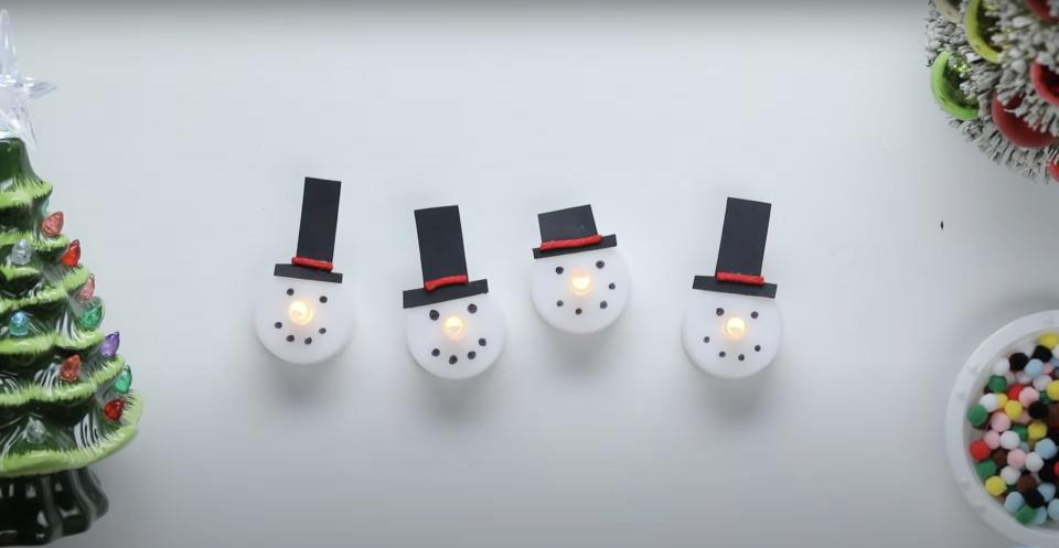 Snowman face figures with hats