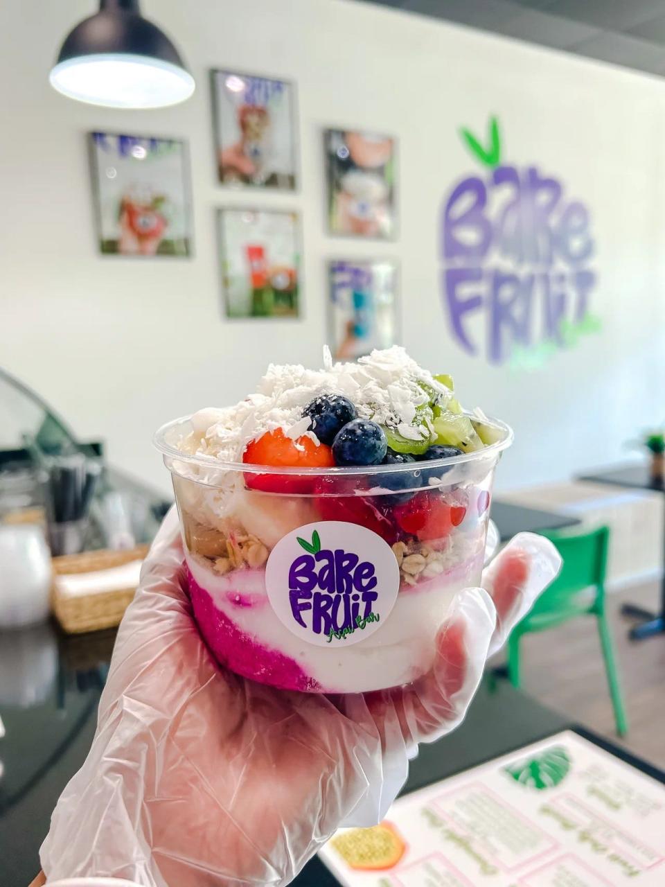 Bare Fruit Acai bar serves bowls just like this one, the "Jamaican Me Happy" with coconut and dragon fruit base, granola, kiwi, strawberry, blueberry, banana and coconut flakes.