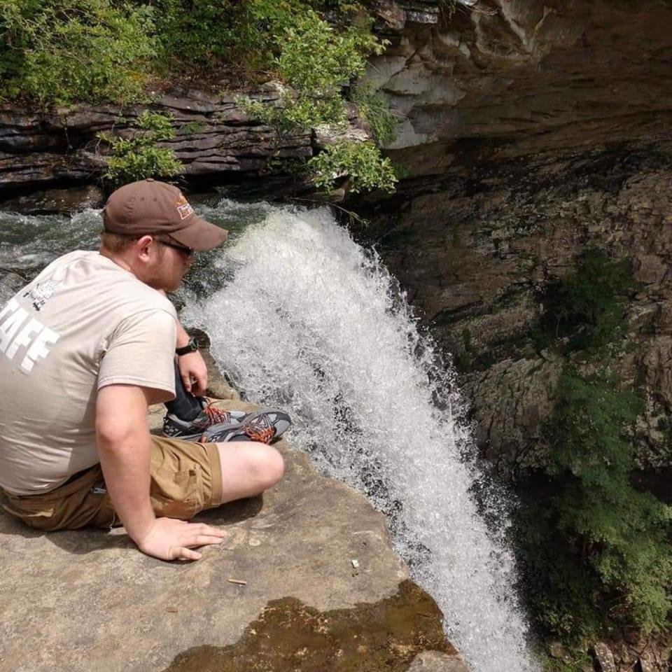 Nathan Davis rests near a waterfall. Nathan died Jan. 13 after a car crash in Maynardville. He loved spending time outdoors and had been trying to lose weight to donate a kidney to his father, according to his family.