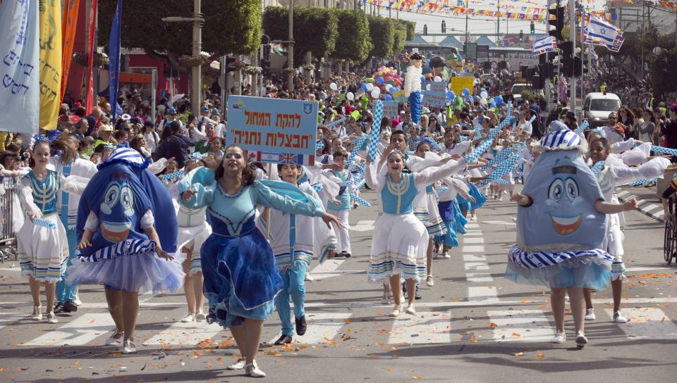 Dressed up Israelis take part in a parade to celebrate the Jewish holiday of Purim on February 24, 2013 in the central Israeli city of Netanya. (Jack Guez/AFP/Getty Images)