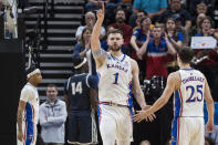 Kansas center Hunter Dickinson (1) celebrates after a play with Kansas guard Nicolas Timberlake (25) during the first half of a first-round college basketball game against Samford in the NCAA Tournament in Salt Lake City, Thursday, March 21, 2024. (AP Photo/Isaac Hale)