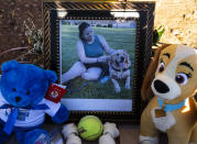 FILE - A portrait of Tina Tintor, 23, and her dog is displayed at a makeshift memorial site to honor them at South Rainbow Boulevard and Spring Valley Parkway, on Thursday, Nov. 4, 2021, in Las Vegas. Former Las Vegas Raiders player Henry Ruggs was sentenced Wednesday, Aug. 9, 2023, in Las Vegas, to at least three years in a Nevada prison for killing a TIntor and her dog in a fiery crash while driving his sports car drunk at speeds up to 156 mph on a city street nearly two years ago. (Bizuayehu Tesfaye/Las Vegas Review-Journal via AP)