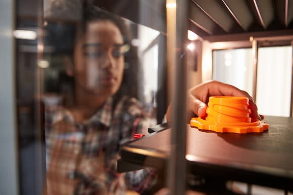 Person printing 3D parts