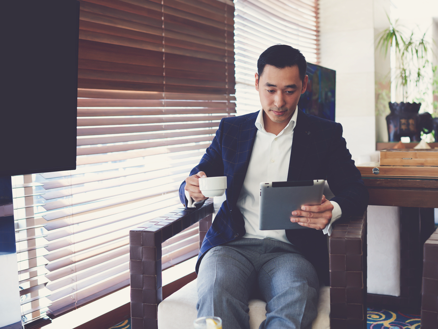 resume young man reading paper multitasking work working