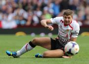 Liverpool's Steven Gerrard sits on the pitch during the match 