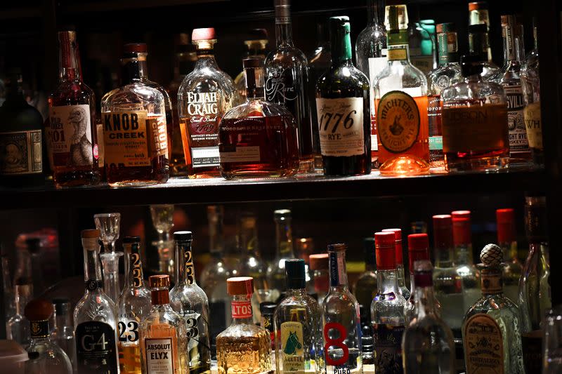 Bottles of spirits and alcohol are seen at Hawksmoor, on the opening day of "Eat Out to Help Out" scheme in London